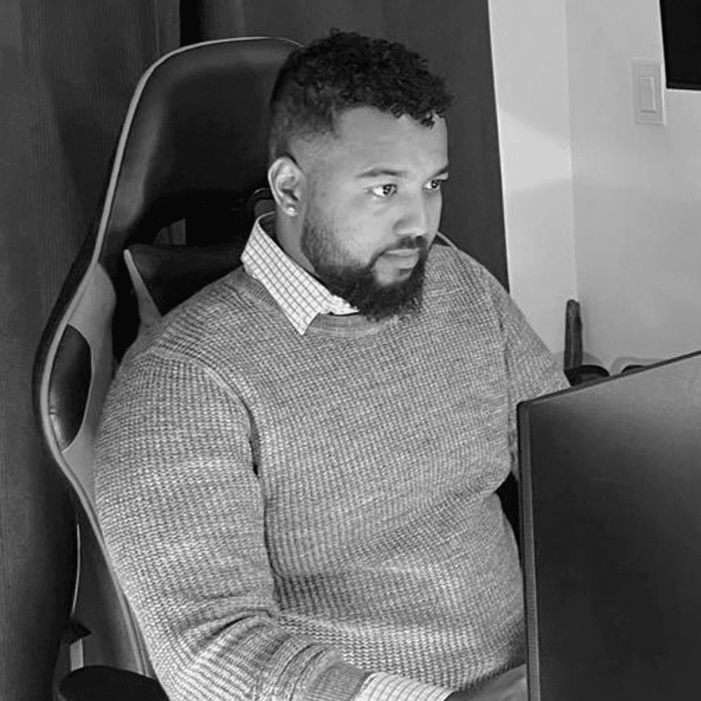 Luciano, founder, at his desk